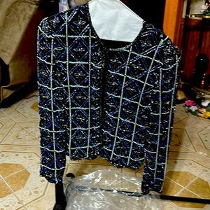 Jacket black background with blue and silver sequins. Long sleeve.
